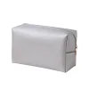 Isolated product view of a silver Saffiano cross-grain cosmetic bag with zipper closure on a white background.
